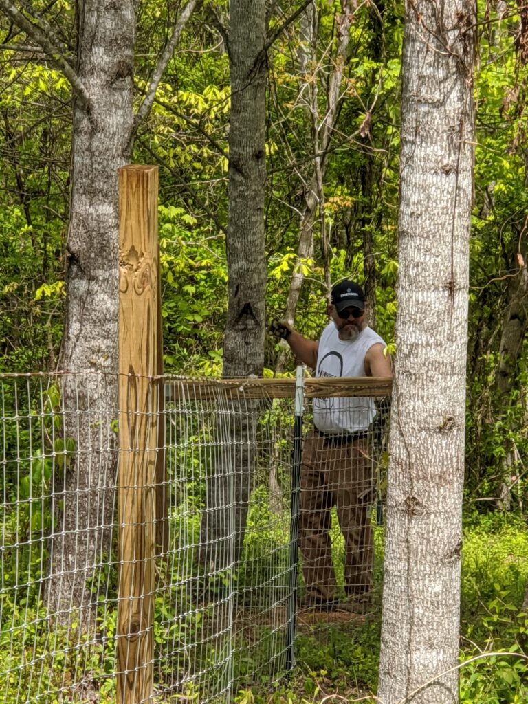 Josh fencing at Kiser Ridge Farm